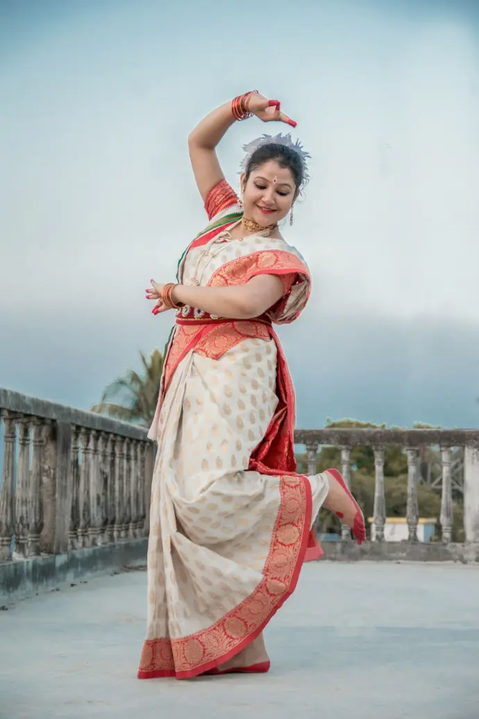 girl in white and red dress standing on gray concrete floor during daytime